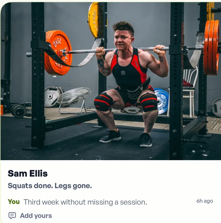 A photo card in Fika: a lifter coming out of a heavy squat, posted by Sam Ellis with the note squats done, legs gone, and a reply reading third week without missing a session.