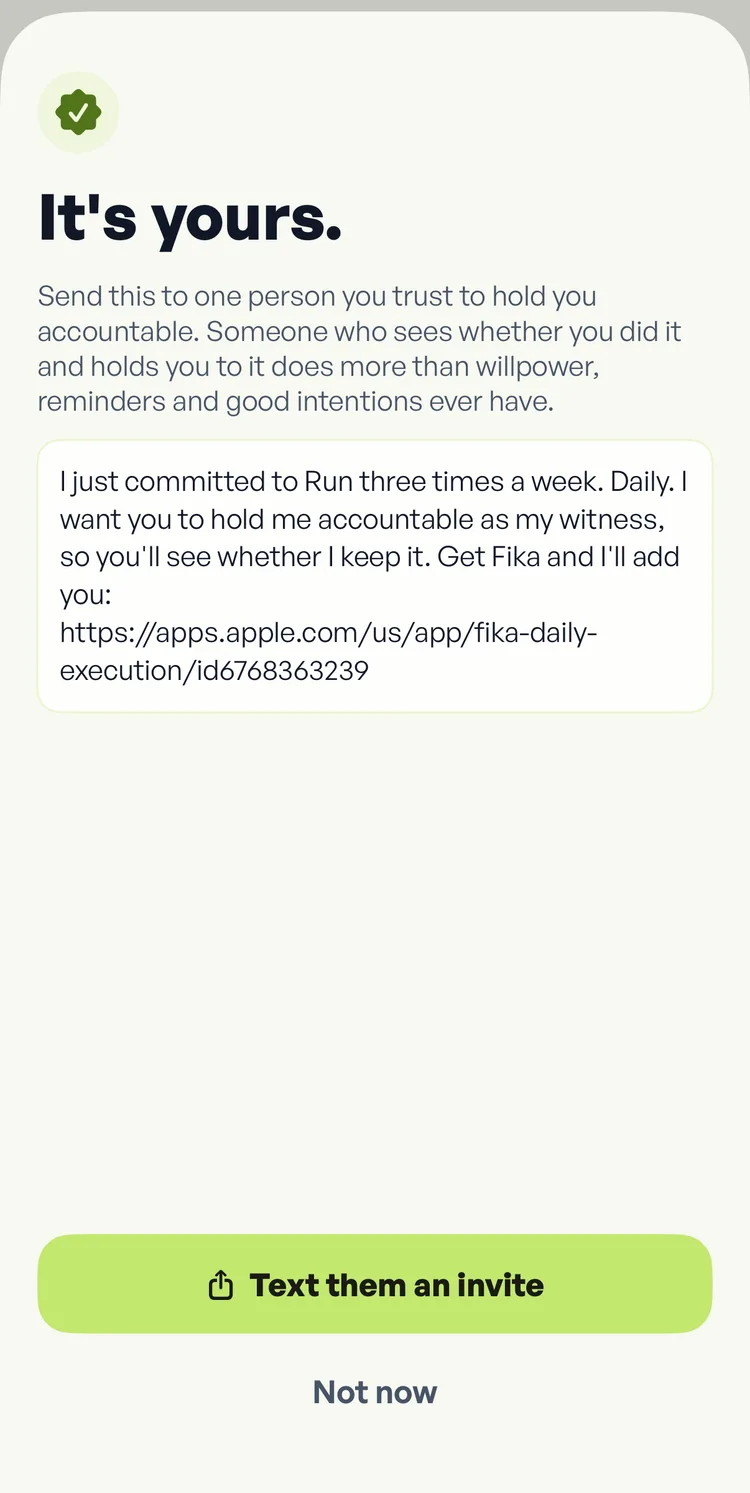 The Fika screen after sealing a commitment, headed it's yours, with a ready-written invitation naming the commitment and a button reading text them an invite.